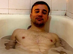A bearded man with tattoos has sex with a hung tourist