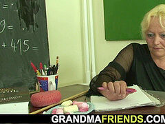 Blonde grandmother tutor dual penetration in the classroom