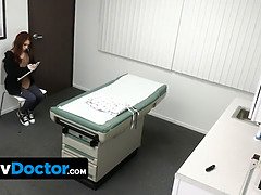 Cute ginger young pays her corporal examination with her delicious narrow pussy in the doctors office