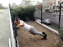 Muscular guy works out and meets with a street agent