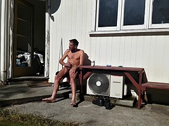 Handjob while sunbathing