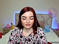Ginger amateur babe NicolPot with big boobs strips down to bra on webcam