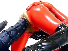 Kinky woman wearing latex and boots while riding