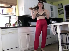 Roxanne strips naked in her white kitchen