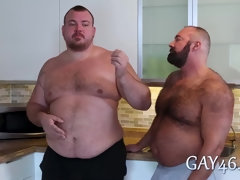 Two fat guys with sexy bellies fucking in the kitchen